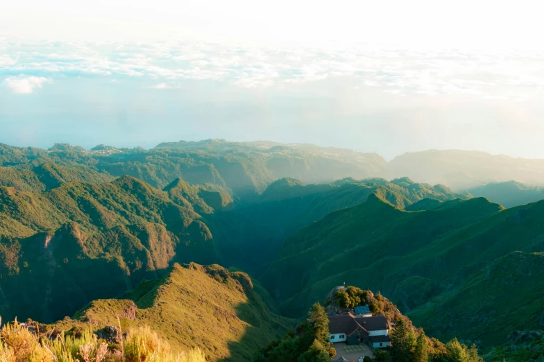 the mountain peaks look great with green vegetation in their front