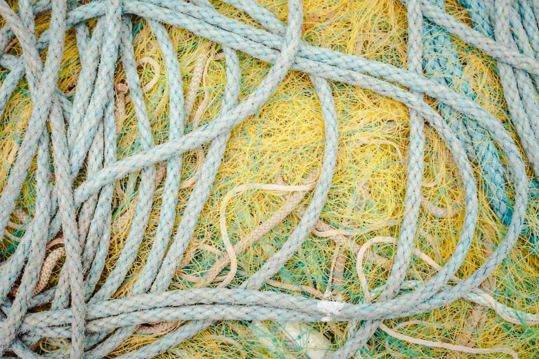 an image of fishing net with green string