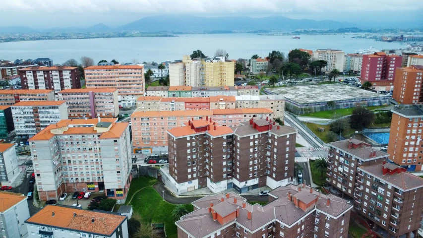 a view of an aerial image of buildings and the ocean