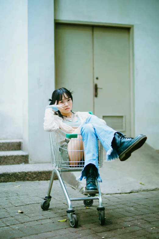 woman leaning on chair while sitting in a shopping cart