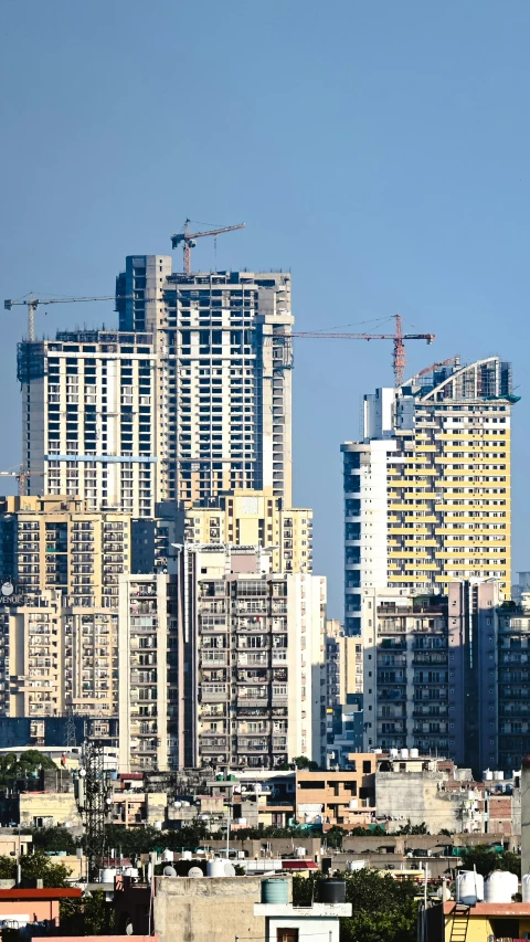 a tall city with lots of buildings in front of it