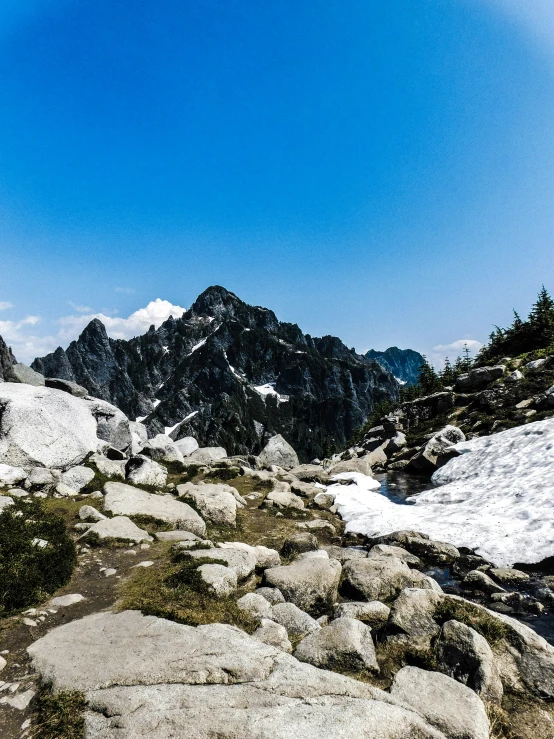 a very snowy mountain is in the distance