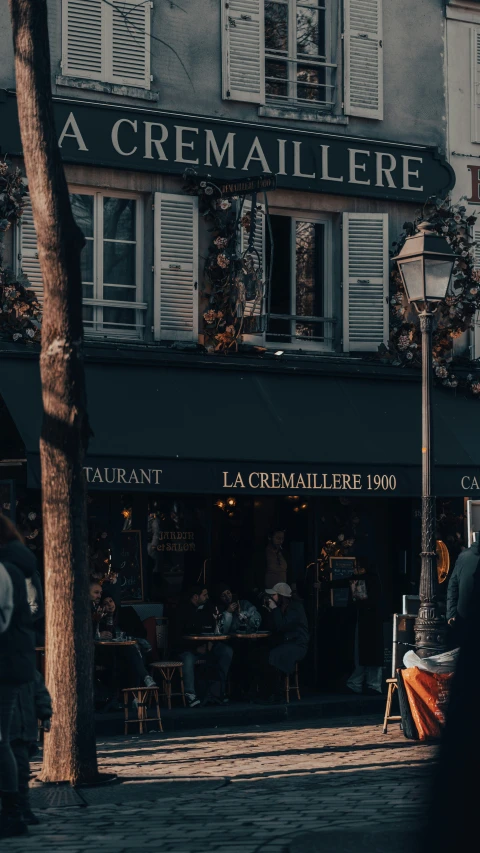 an empty sidewalk in front of a small shop