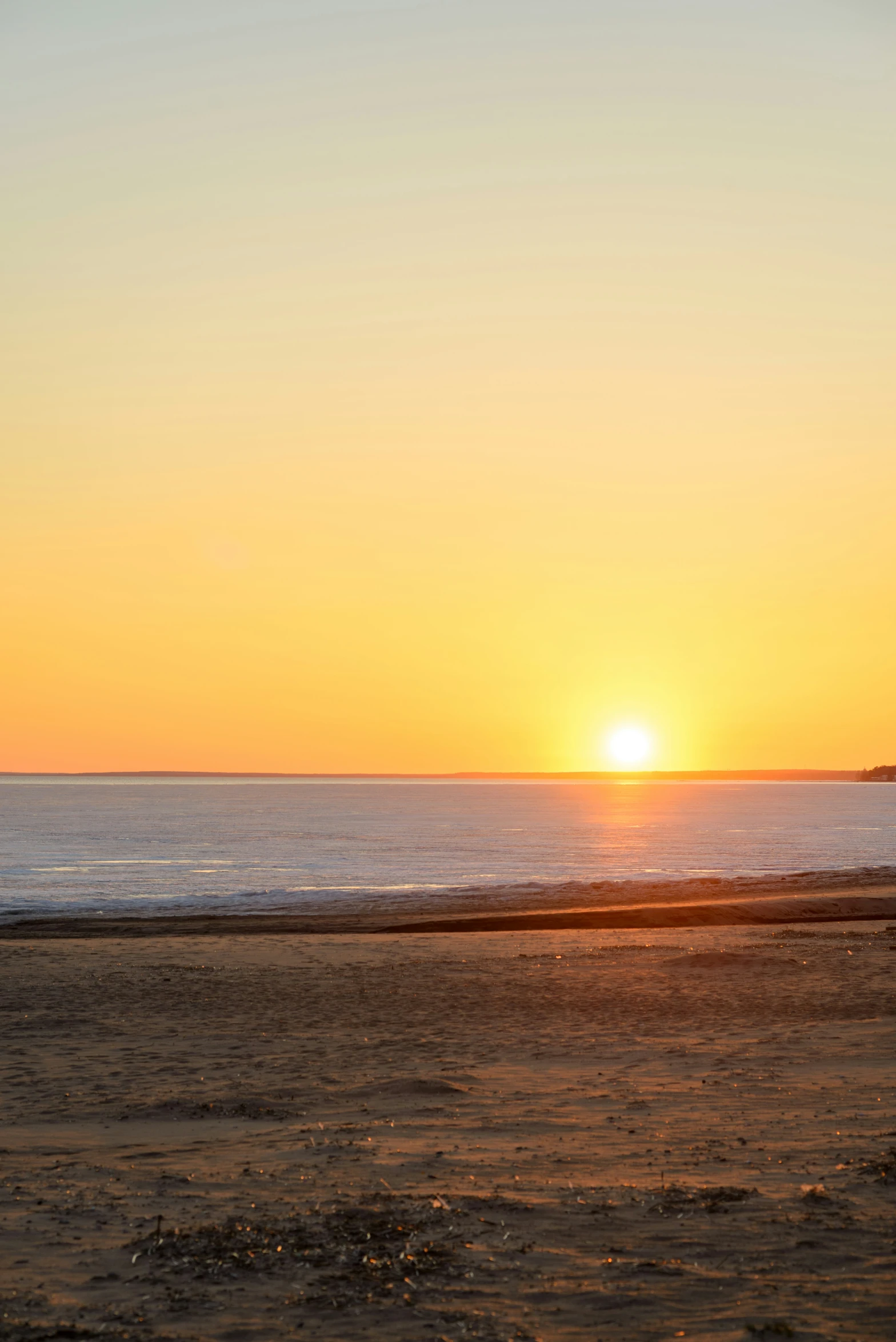 a man that is walking on the beach