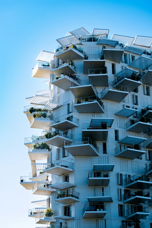 a tall building is holding several balconies