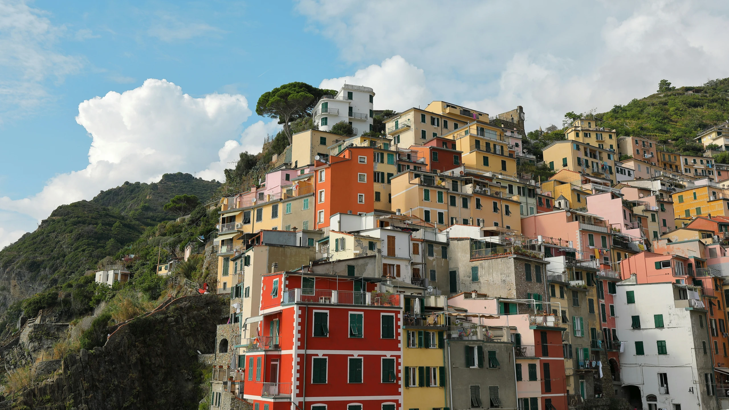 this is a very tall residential building built into the hill