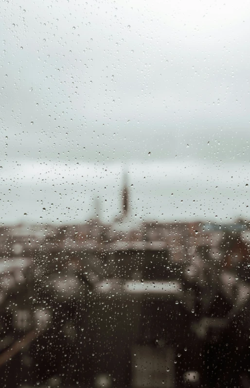 a city view through a rainy window