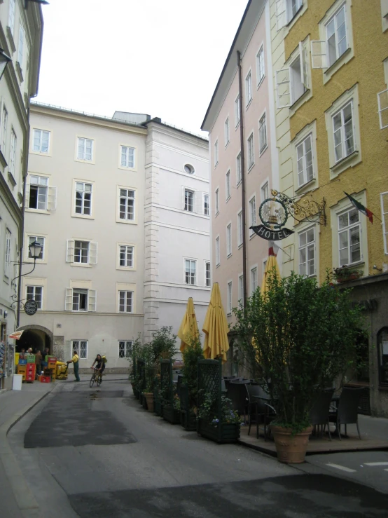 a street filled with lots of tall buildings next to buildings