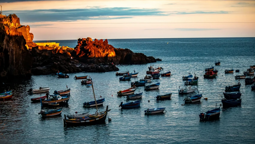 a harbor with many small boats sailing in it