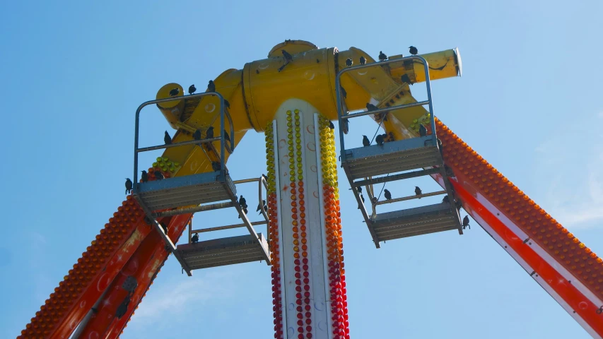 there is a roller coaster that looks like it has two people at the top