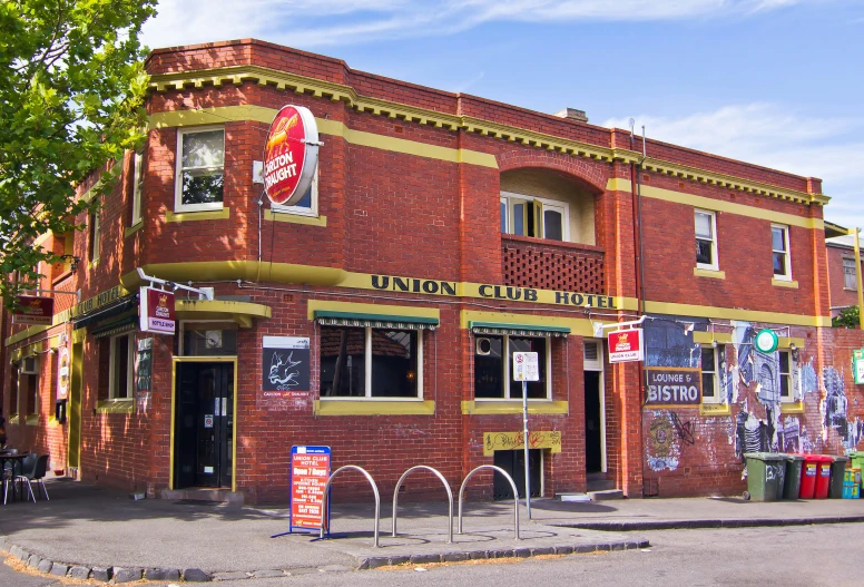 the corner of a town building with a motorcycle in front