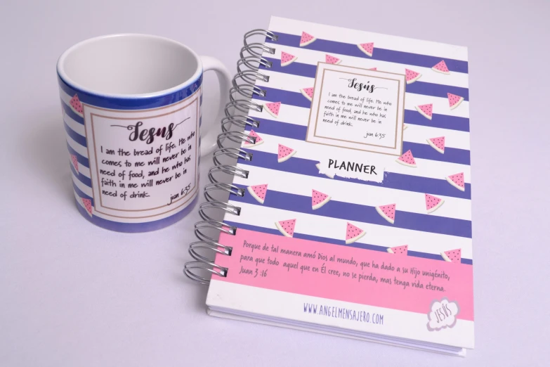 a book with an attached cover and coffee mug sitting on the table