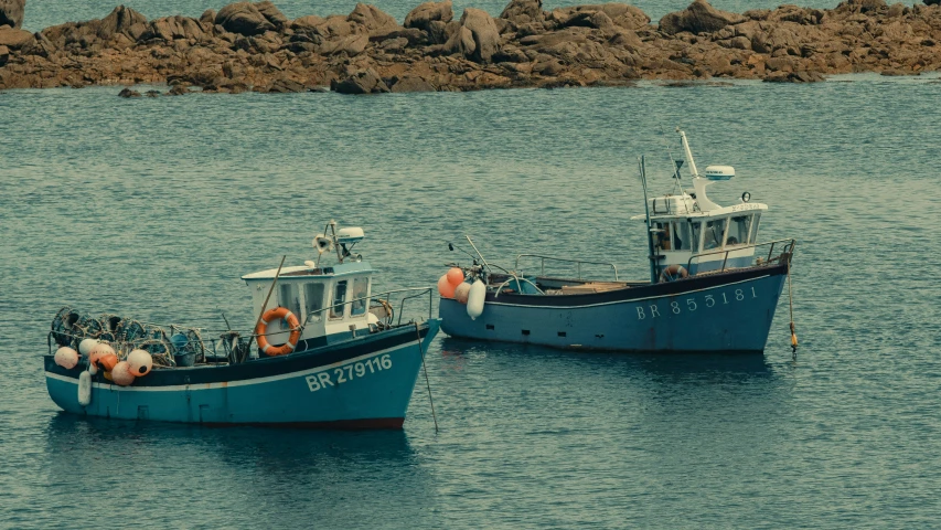 two large boats near each other in the water