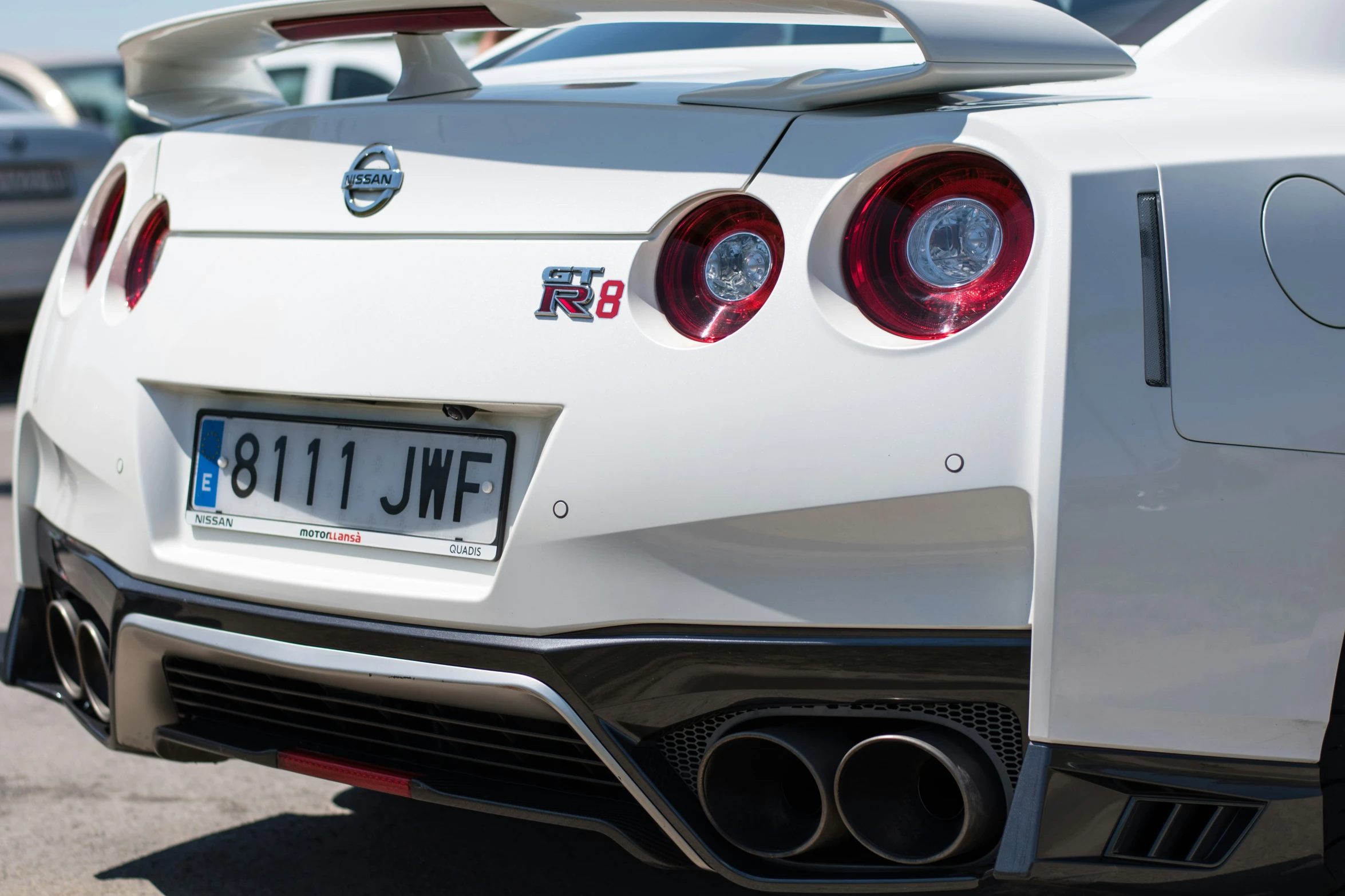 the tail lights and grilles of a car