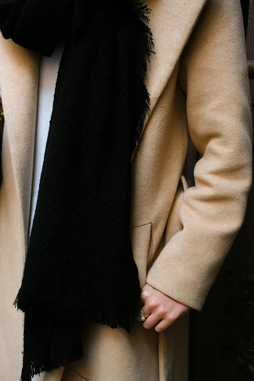 a person wearing a black and white scarf