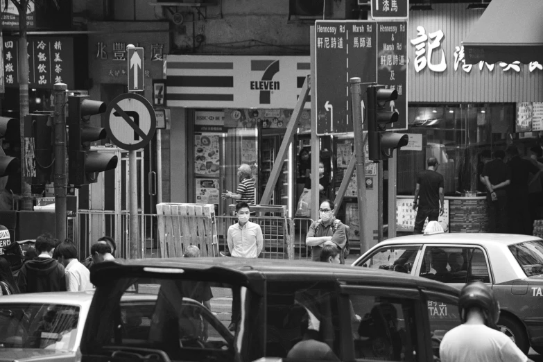 pedestrians and cars on an oriental city street