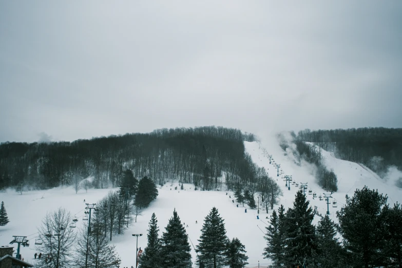 the snow slopes are very cloudy on a dark winter day