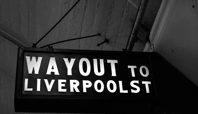 sign that says way out to liverpool on it