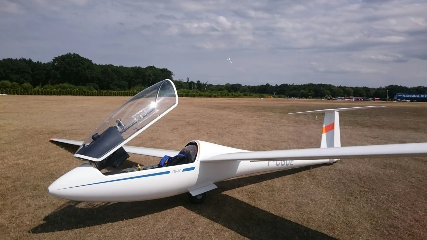 a glider on display at an airshow during the day