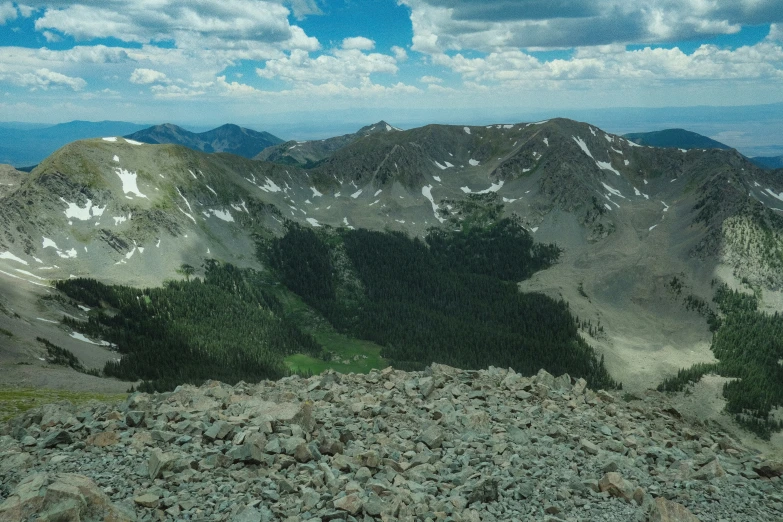 mountains in the background with sp grass on the ground