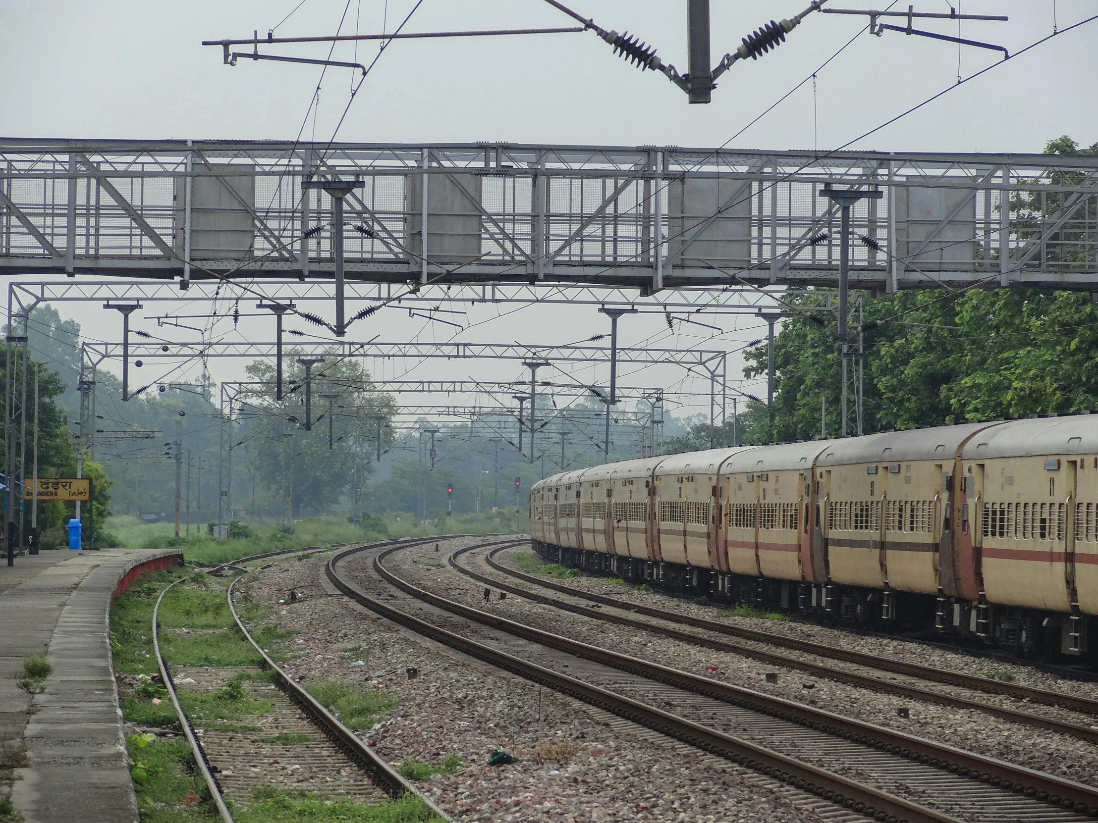 the train is passing under a bridge