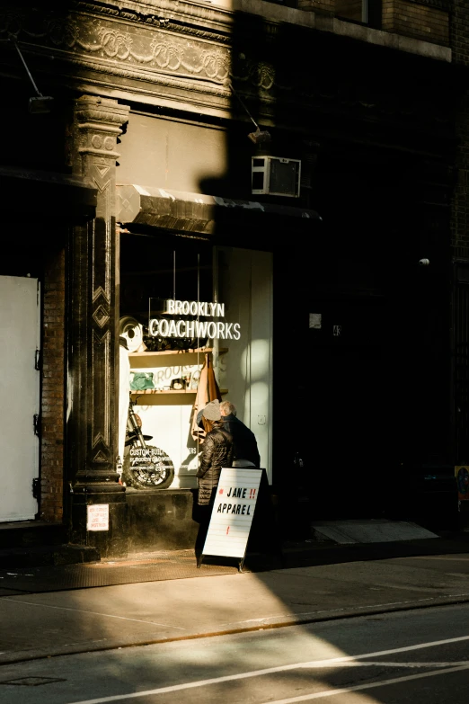 the front window of an establishment is lit by sunlight