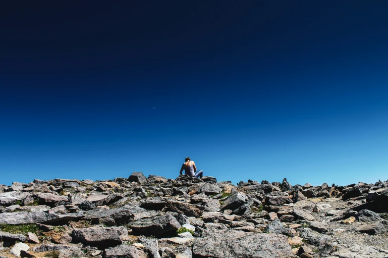 a man is on top of an ancient mountain