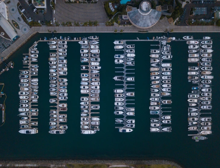 an aerial view of boats docked in the water