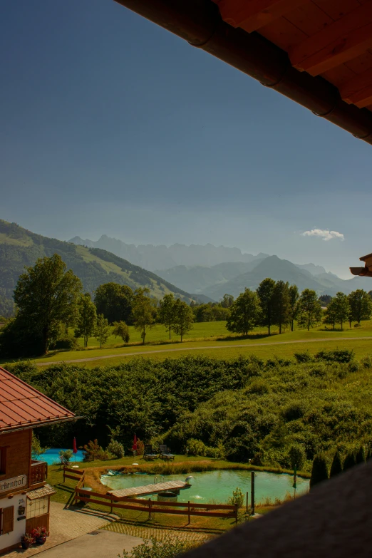 the mountain range is behind the small park