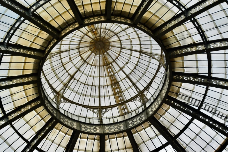 the dome of a building with glass and metal