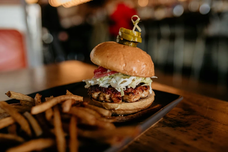 a burger with a crown on it with some fries