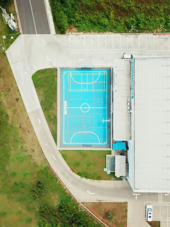 an aerial view of a basketball court in a sports complex