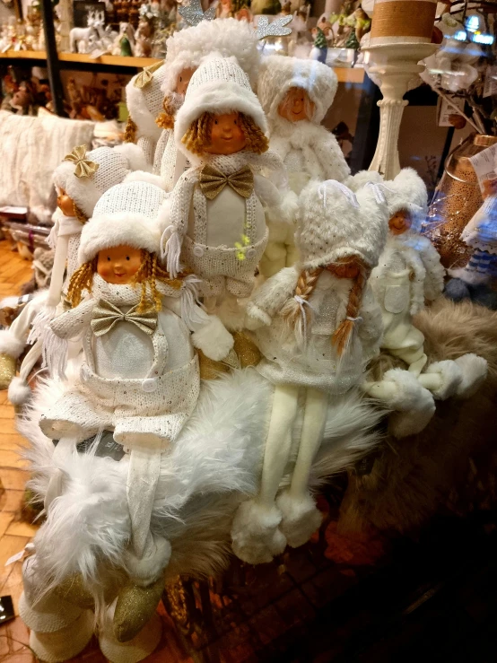 a pile of dolls sitting on top of a table