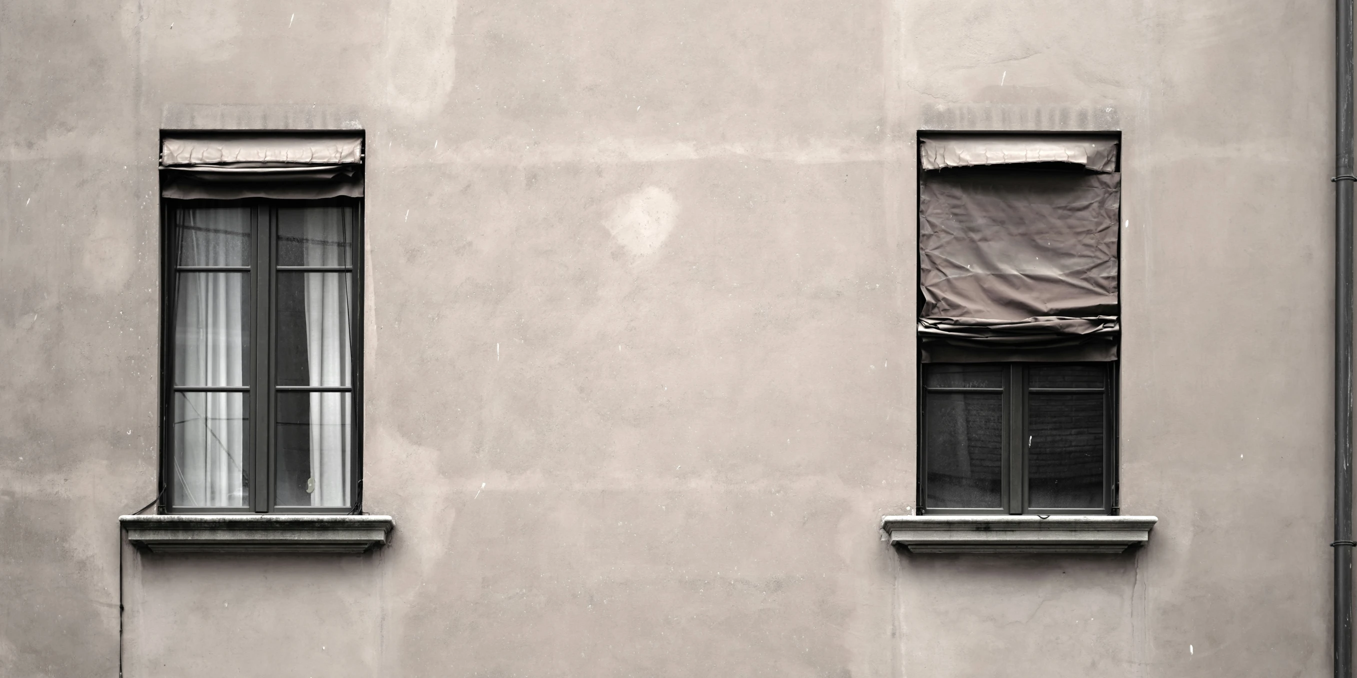 two window boxes sitting in the windows on top of a building