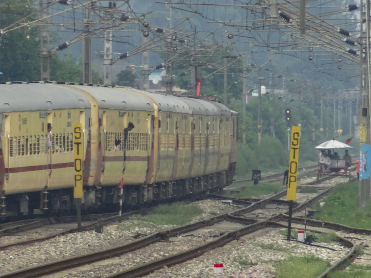 a train on the tracks running through a rural area