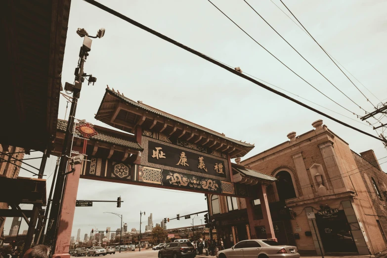 a bridge that leads to a chinese styled building