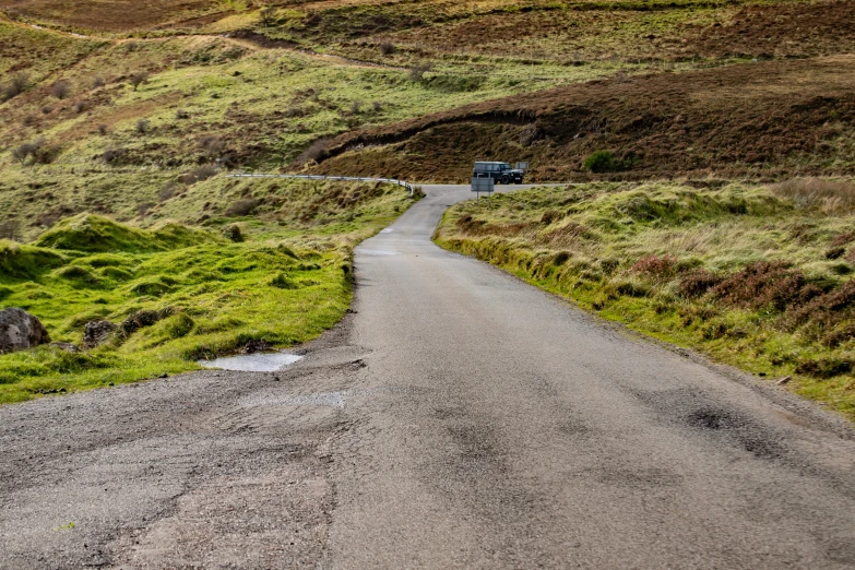 an empty road in the middle of the countryside