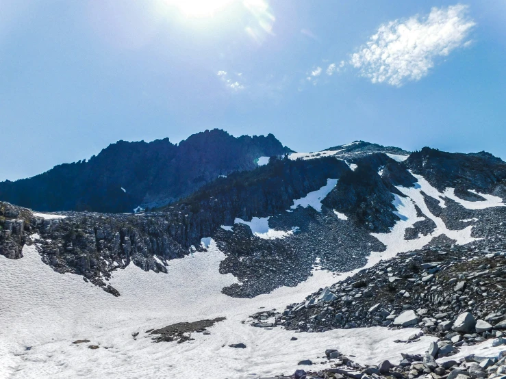 a po of a mountain with a large snow covered rock face