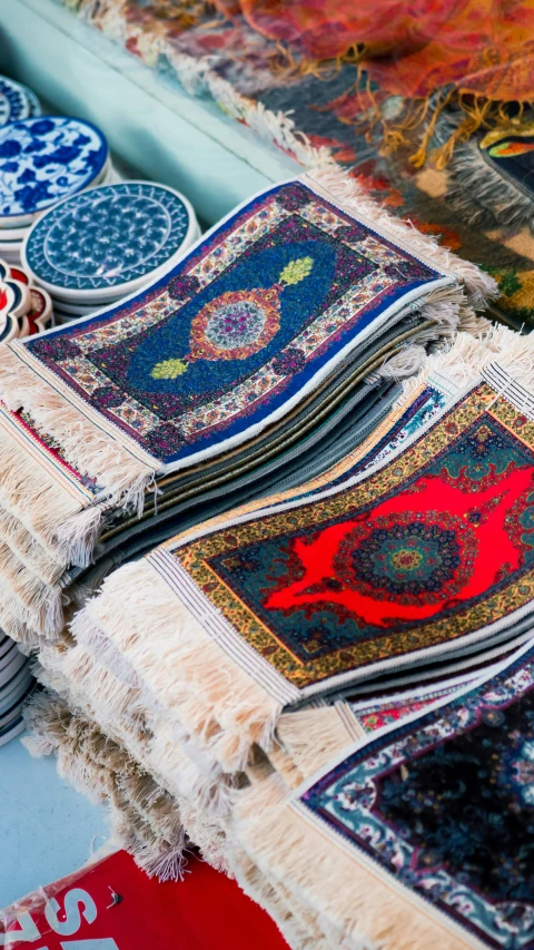 carpet rugs and plates laying on the ground