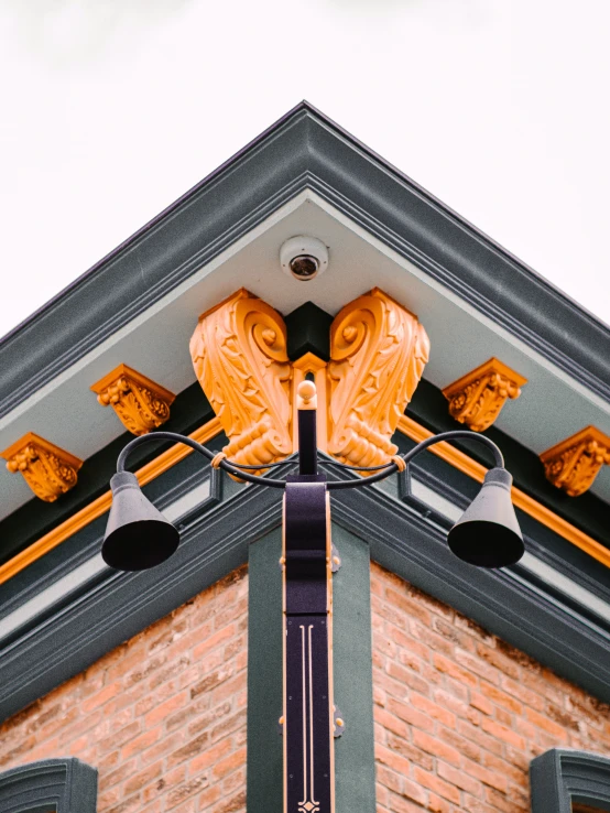 the outside of a building with two decorative lights