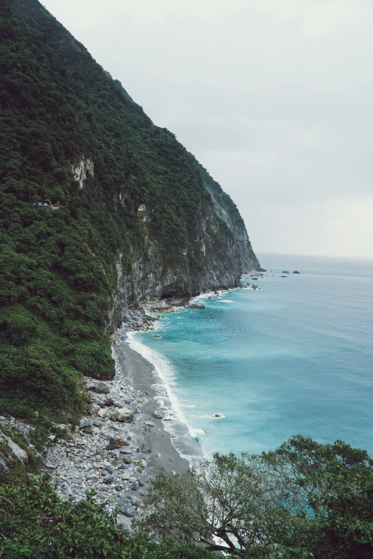 the coastline is shown on a cloudy day