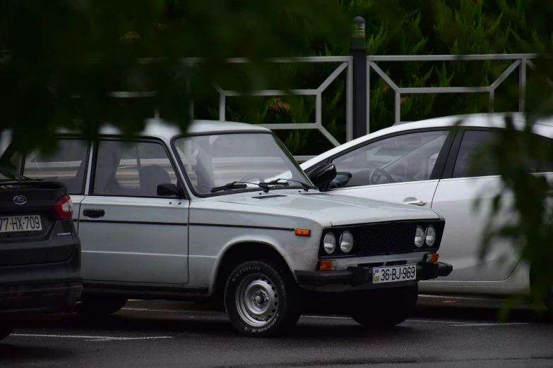 a car parked on the road next to another car