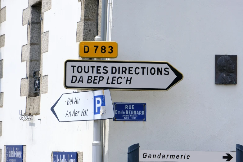 the street signs are in foreign and english