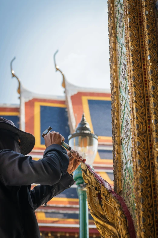 a man is looking through a doorway of the grand palace