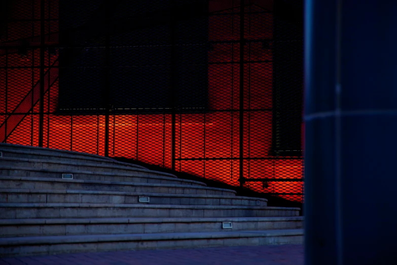 a stair case with red lighting at night