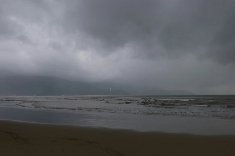 stormy skies hover over the beach on an overcast day