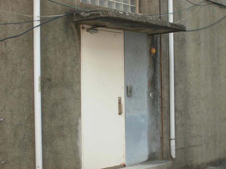 a door that is next to a wall with wires