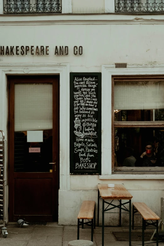 outside a cafe with a chalkboard in the window