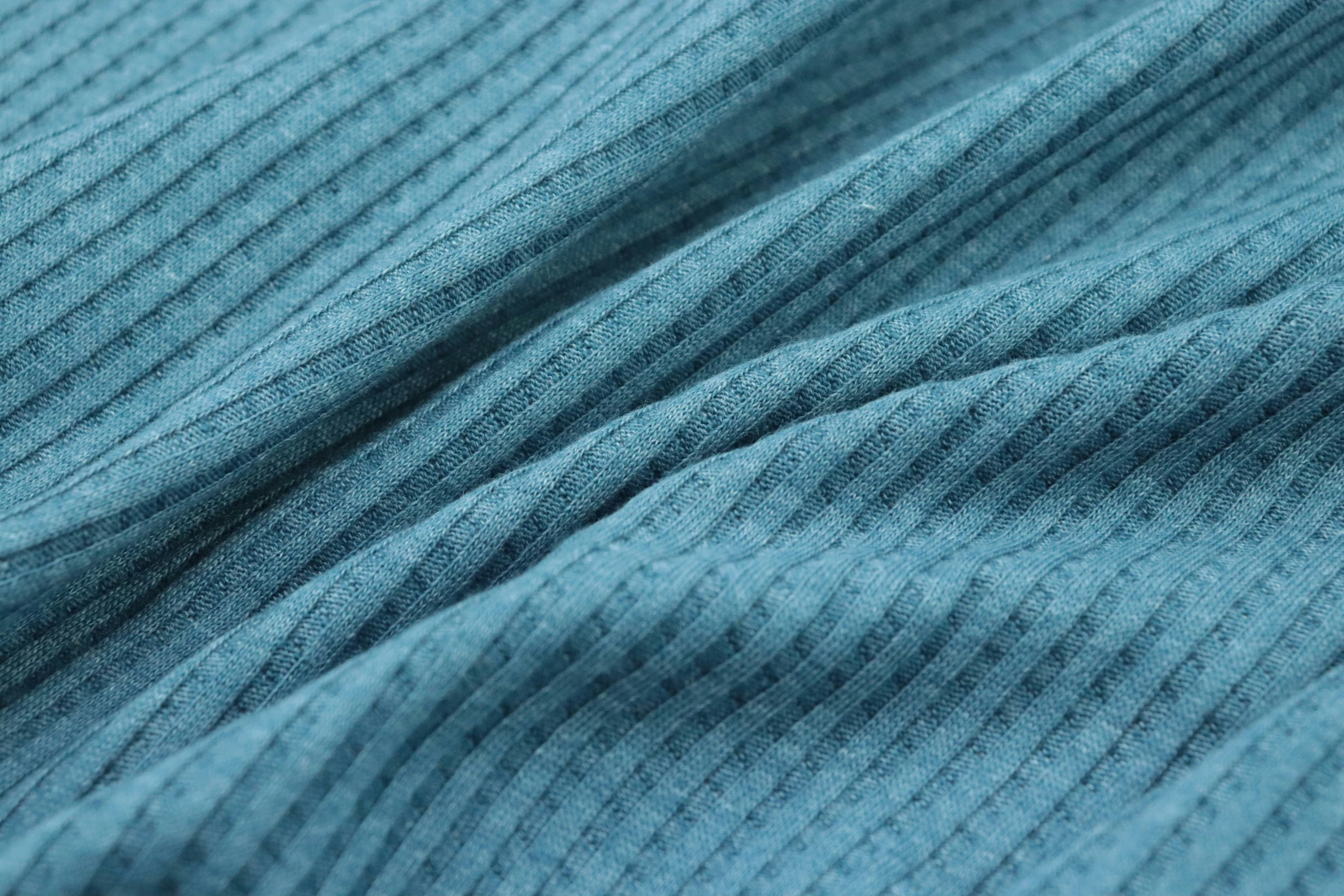 textured blue fabric close up s with vertical stripes