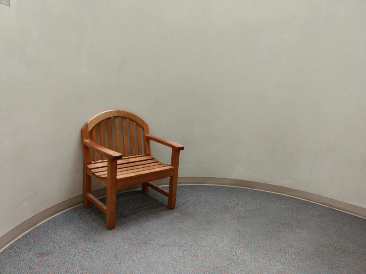 a small bench in a corner of a room